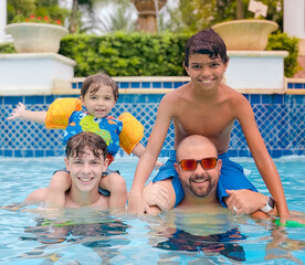 father and son having fun in pool at lakeshore reserve 