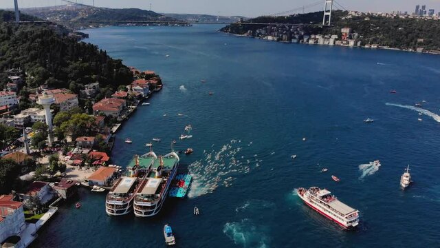 Aerial view of people swimming between Europe and Asia 4K. Bosphorus bridge drone footage 4K