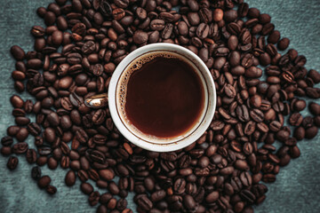 Close-up of vintage cup of Turkish coffee with coffee beans on the side.