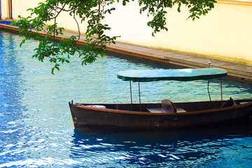 Naklejka na ściany i meble Gondola, a small pleasure row boat on the city canal