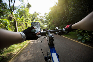 Use smart phone app for navigation while bike ride on the forest trail