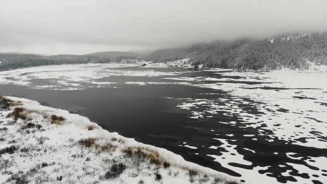 Aerial footage of Abant national park in  snowy winter time. Beautiful landscape with frozen lake. Bolu, Turkey.