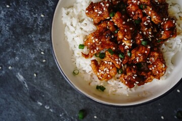 Homemade sesame Chicken served with Jasmine white rice, selective focus