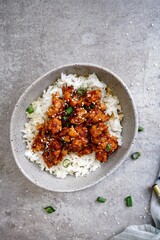 Homemade sesame Chicken served with Jasmine white rice, selective focus