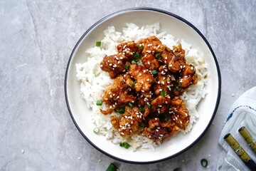 Homemade sesame Chicken served with Jasmine white rice, selective focus