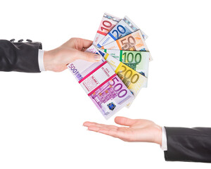Business woman hand in black office suit with euro banknotes packages as fantail give money to...