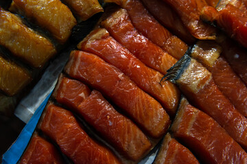 Beautiful smoked red fish fillet on the counter in the market gourmet
