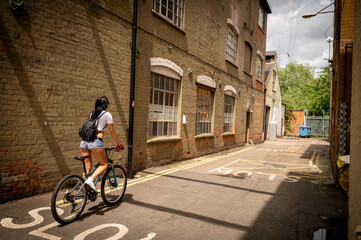 Fototapeta premium young woman riding a bicycle