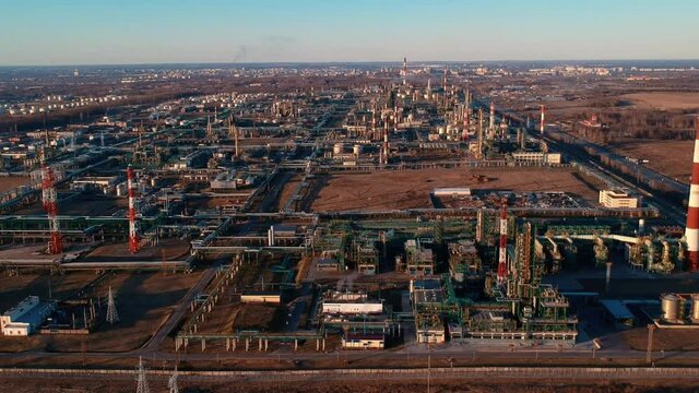 beautiful aerial view large powerful gas and oil refinery industrial complex with pipelines and chimneys against sky. Russia
