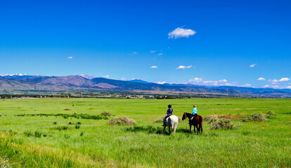 Women riding horses on Colorado's high plains