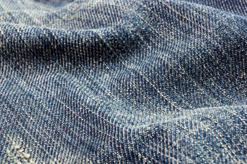 clothing items blue stonewashed faded jeans cotton fabric texture with seams, clasps, buttons and...