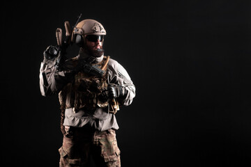 portrait of special forces in a military uniform with weapons at night, elite troops, counter terrorist against a dark background