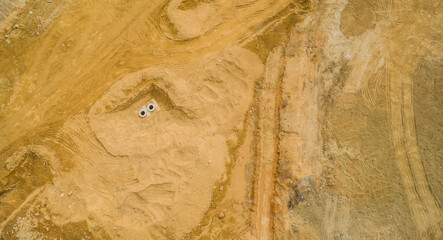 Aerial view of two open manholes