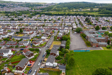 Aerial drone view of a residential area of a small Welsh town surrounded by hills (Ebbw Vale, South Wales, UK)