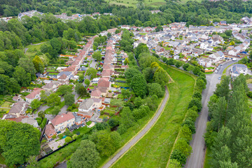 Aerial drone view of a residential area of a small Welsh town surrounded by hills (Ebbw Vale, South Wales, UK)
