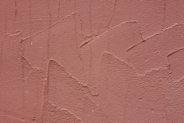 Texture of decorative plaster with a relief. Close-up.