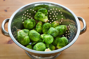 Brussel sprouts in a metal colander