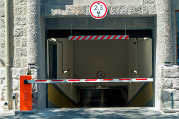 barrier at the entrance to the underground parking of the shopping center