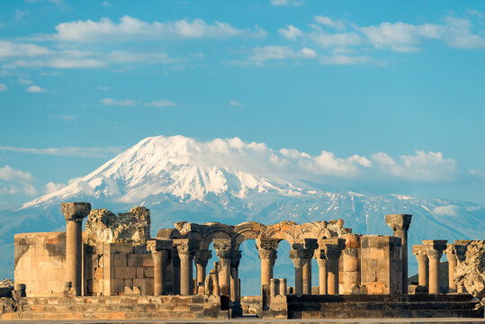 View of Zvartnots Temple on the background of Mount Ararat - a tourist attraction of Armenia