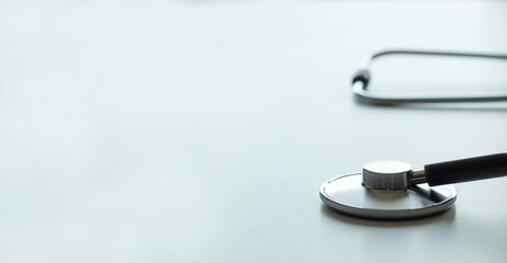 close-up of a statoscope on a white table and free space for text, light green background