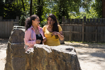 couple of two women talking outdoors