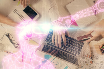 Double exposure of man's hands typing over computer keyboard and virtual reality hologram drawing. Top view. Technology concept. Future.