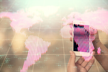 Double exposure of business theme sketch hologram and woman holding and using a mobile device.