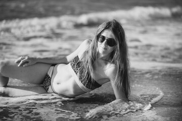 sexy young model by the sea on the beach