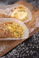 Delicious cannolis on black background