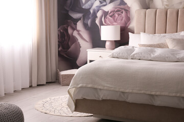 Stylish floral room interior with comfortable bed