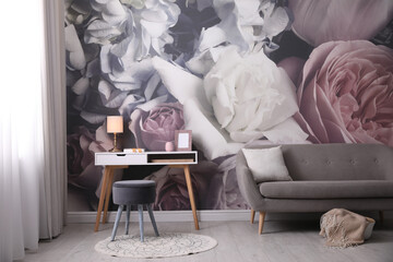 Beautiful room interior with stylish furniture and floral pattern on wall