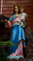 Naklejka premium Statue of Our lady and child Jesus in catholic church, Thailand. selective focus.
