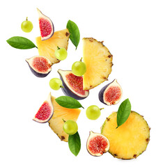 Set of different cut fresh fruits and berries falling on white background