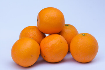 Tangerine fruit Heap on white background. Fresh fruits from India Asia