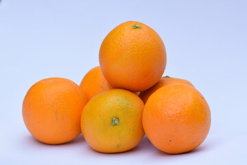 Mandarin fruit Heap on white background. Fresh fruits from India Asia