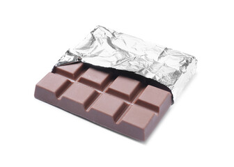 Delicious milk chocolate bar wrapped in foil isolated on white