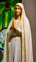 Close up of Statue of Our lady of grace virgin Mary in the church, Thailand. selective focus.