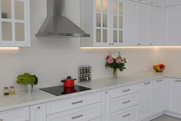 Elegant interior of new kitchen with stylish furniture