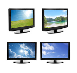 Set of modern plasma TVs with landscape on screens against white background