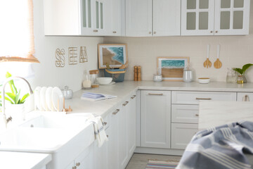 Fototapeta na wymiar Beautiful kitchen interior with new stylish furniture