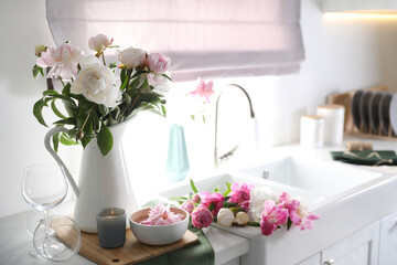 Beautiful kitchen counter design with fresh peonies
