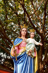 Fototapeta premium Statue of Our lady and child Jesus in catholic church, Thailand. selective focus.