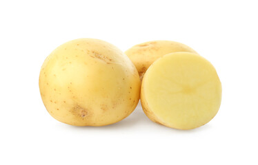 Whole and cut fresh raw organic potatoes on white background