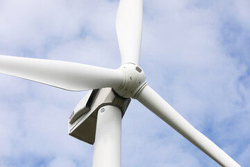 Wind turbine against beautiful sky, closeup. Alternative energy source