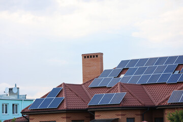 House with installed solar panels on roof