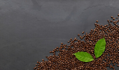 coffee bean on black wooden floor background. top view. space for text