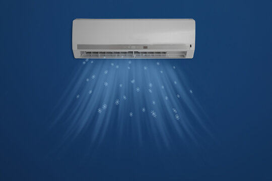 Modern air conditioner on blue wall indoors