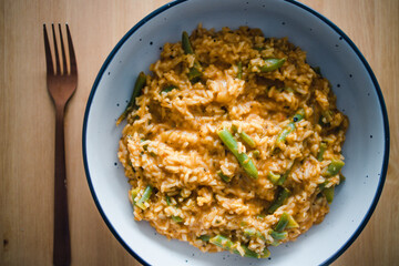 plant-based food, vegan red pesto risotto with green beans