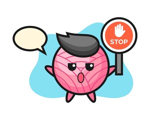 Yarn ball cartoon holding a stop sign