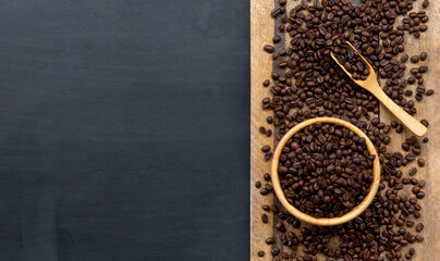 coffee bean on black wooden floor background. top view. space for text